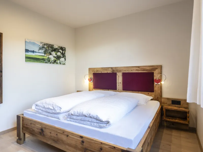 Ferienwohnung Dissertorihof Kaltern Vernatsch Bett