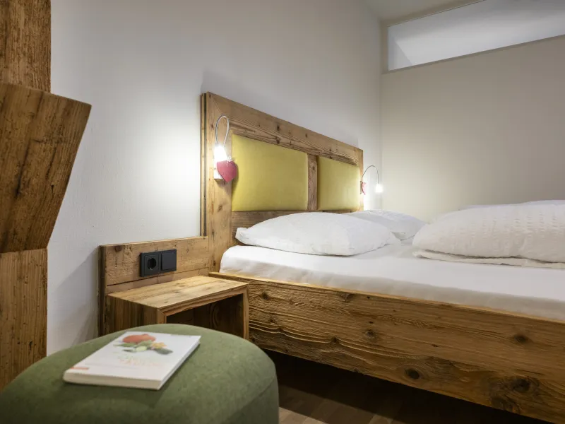 Ferienwohnung Dissertorihof Kaltern Weißburgunder Bett