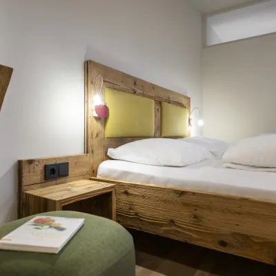 Ferienwohnung Dissertorihof Kaltern Weißburgunder Bett