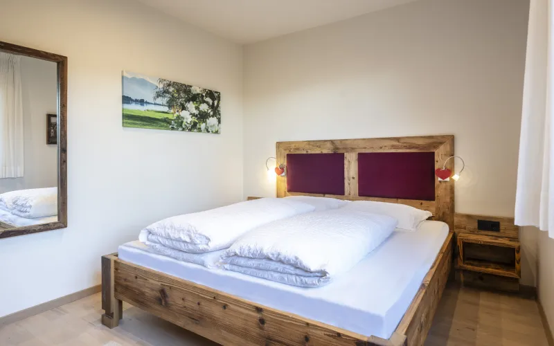 Ferienwohnung Dissertorihof Kaltern Vernatsch Bett