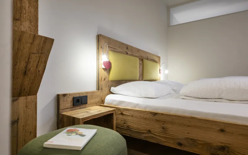 Ferienwohnung Dissertorihof Kaltern Weißburgunder Bett