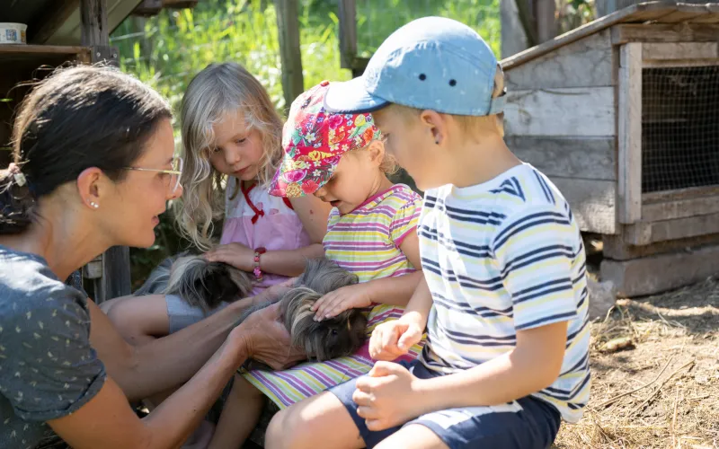 Children at the petting zoo at Dissertorihof in Kaltern